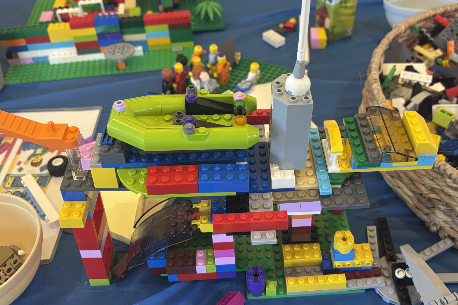 A multi-level LEGO build with a boat on an upper deck